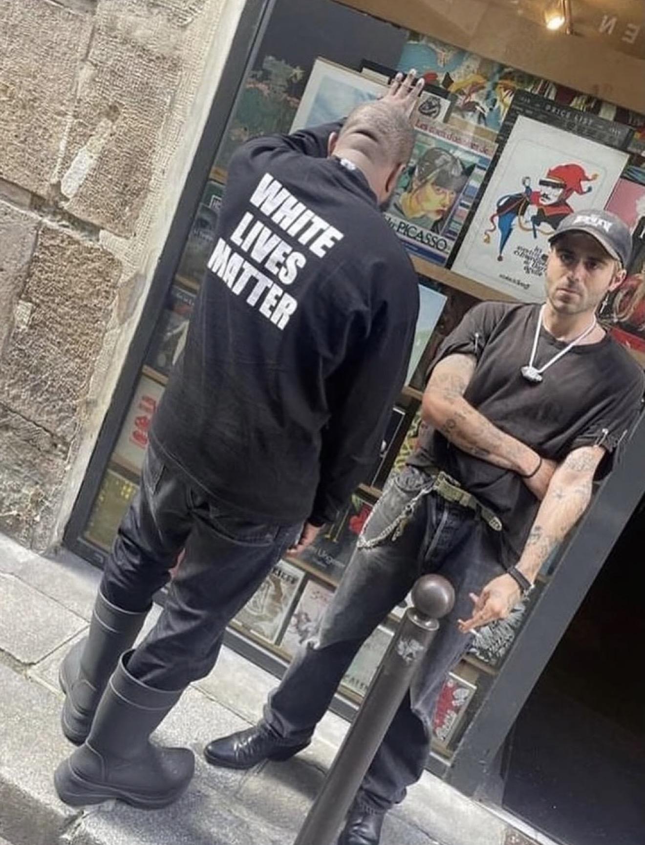 Ye in a “White Lives Matter” shirt beside Levy.